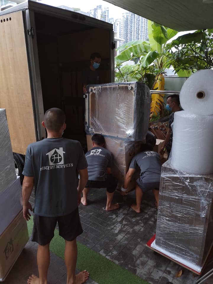 Group of Ascent Movers employees finishing a furniture move.